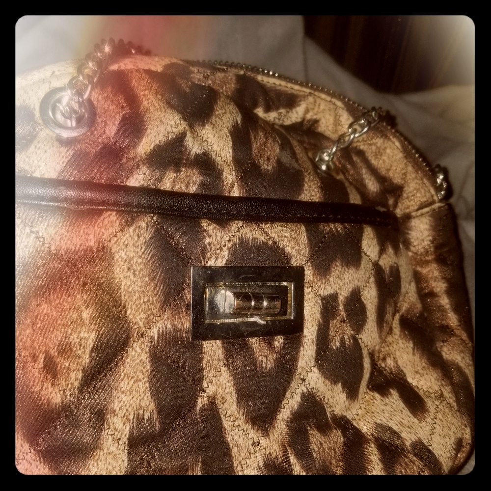 Little cheetah print purse with metal straps